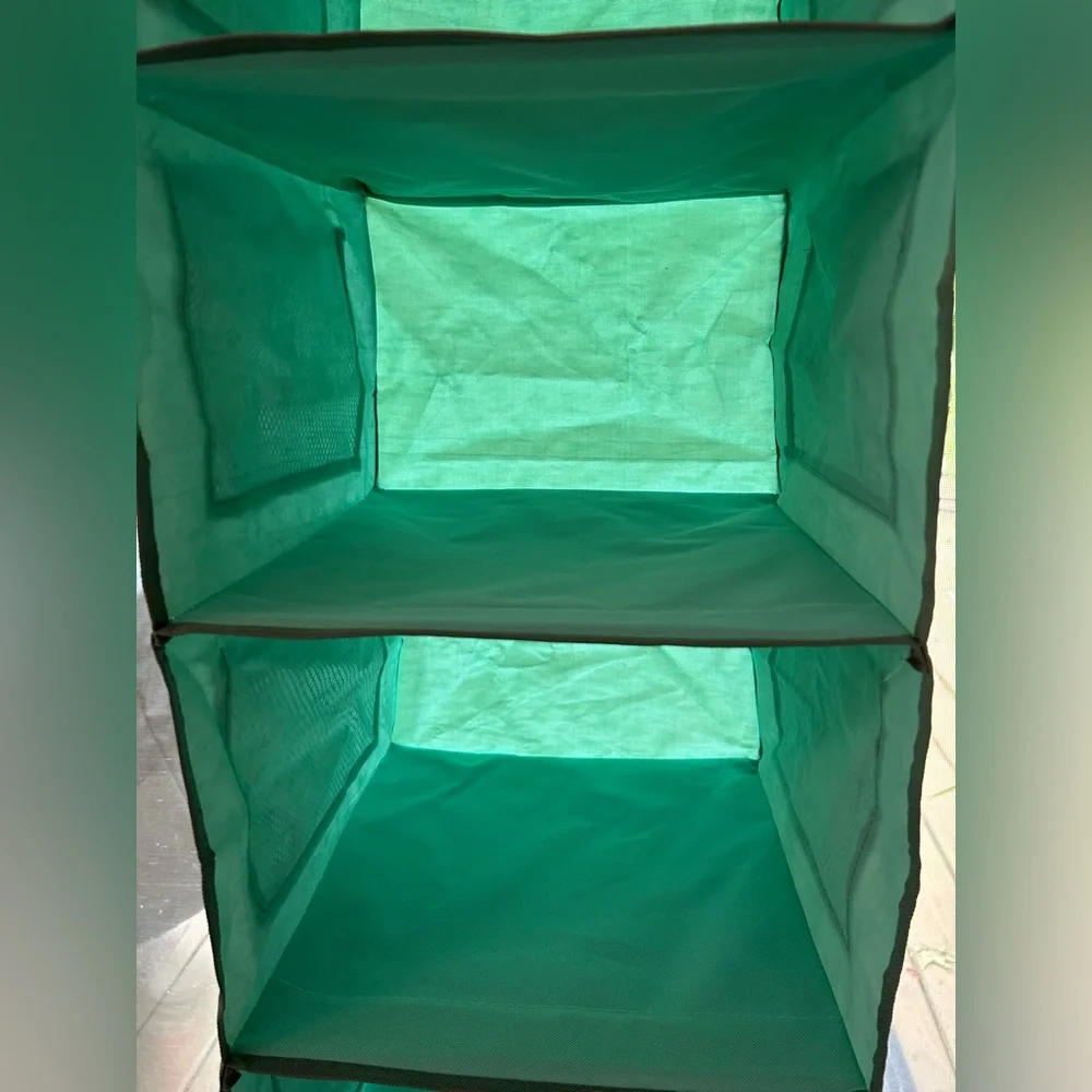 Aqua 6 shelf Storage Organizer. Hangs on closet rod. 12 mesh pockets on outside.